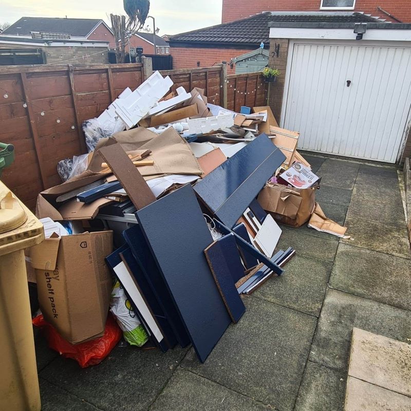 Pile of Boxes and junk in garden