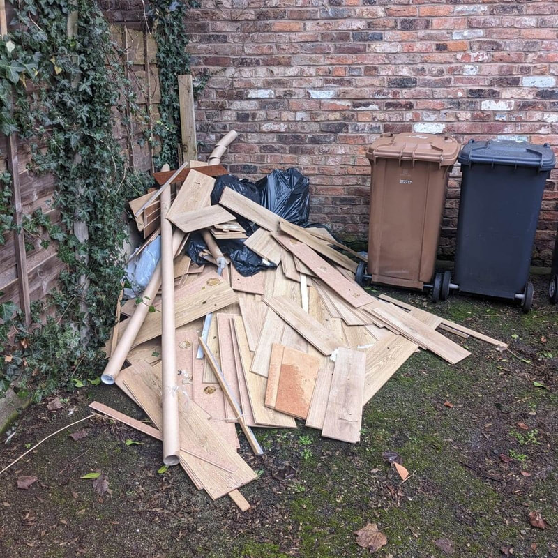 Pile of laminated flooring in the back garden used.