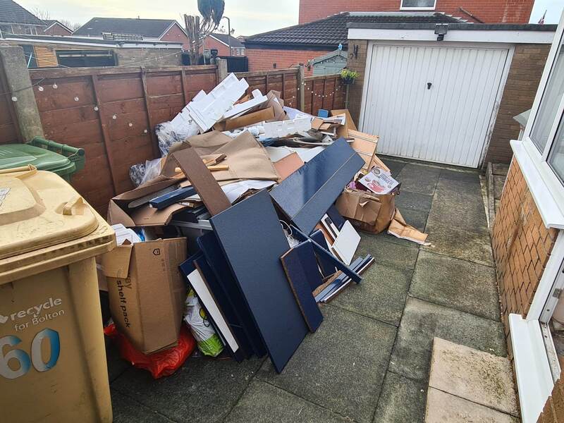 Cardboard and rubbish in the garden